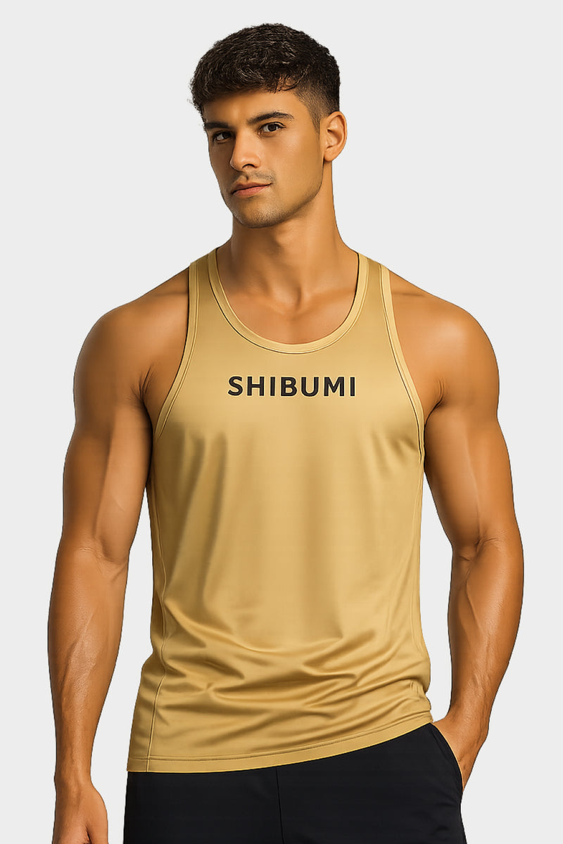 Man wearing a beige tank top with 'SHIBUMI' branding on a white background
