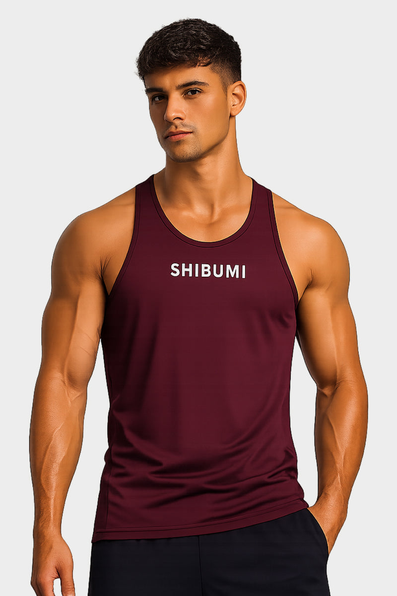Man wearing a maroon tank top with 'SHIBUMI' text on a plain background
