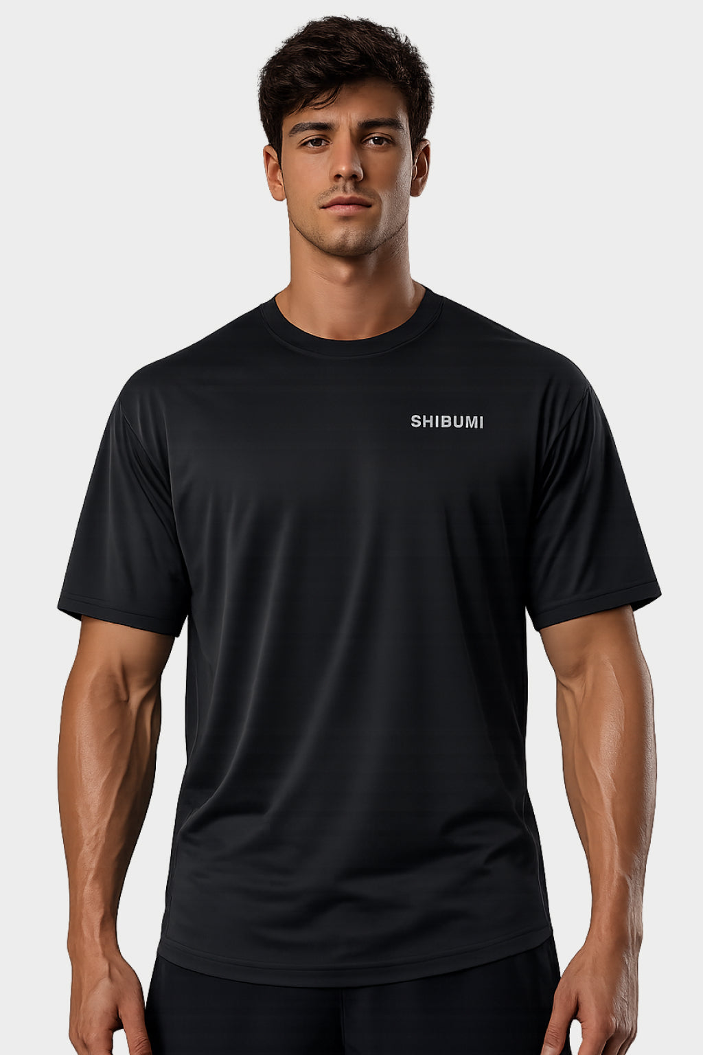Man wearing a black t-shirt with 'SHIBUMI' logo on a white background