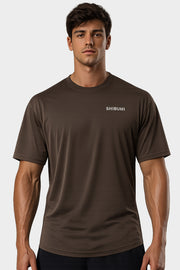 Man wearing a brown t-shirt with 'SHIBUMI' logo on a white background