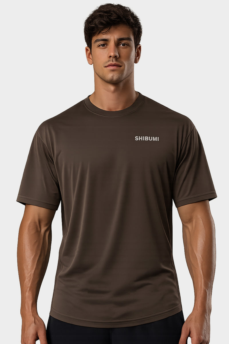 Man wearing a brown t-shirt with 'SHIBUMI' logo on a white background
