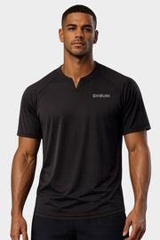 Man wearing a black t-shirt with 'SHIBUMI' logo on a light gray background