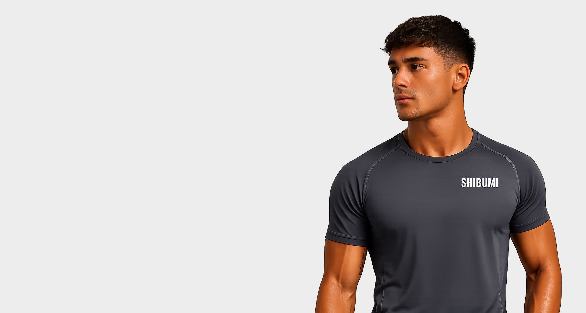 Man wearing a black t-shirt with 'SHOSHIIN' logo on a light gray background